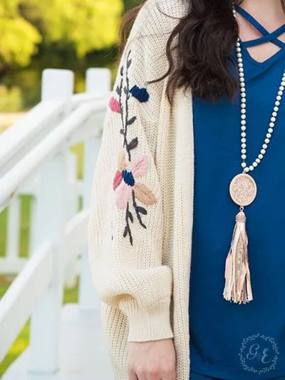 Thick knit cardigan with embroidered flower sleeves