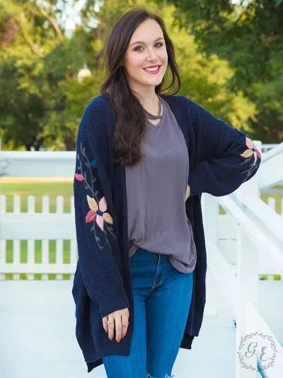 Thick knit cardigan with embroidered flower sleeves